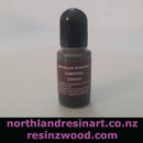 Bottle of metallic pigment labeled 'Coffee' with a black cap on a white background, featuring website text at the bottom.