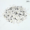 White and black speckled decorative gravel on a light gray background