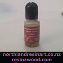Small bottle of metallic pigment with a purple label on a white background, featuring the brand 'northlandresinart.co.