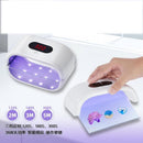 Nail dryer with digital timer and hand interacting with it on a white background