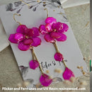 Pink floral earrings on a Flicker & Fern branded card.