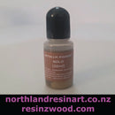 Bottle of metallic pigment gold on a white background with branding text.