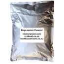 Bag of impression powder with a label displaying website URLs on a white background