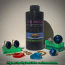 UV resin bottle with jewelry pieces on a neutral background