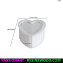 White  heart shaped silicone mould with measurements on white background